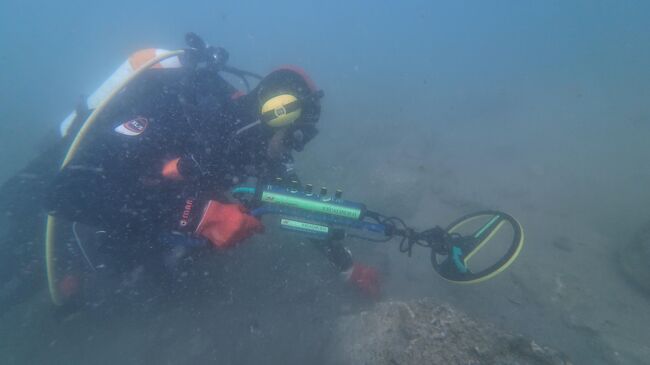 Работа с металлодетектором