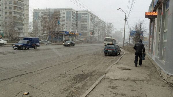 Иркутский тракт в Томске во время весеннего снегопада