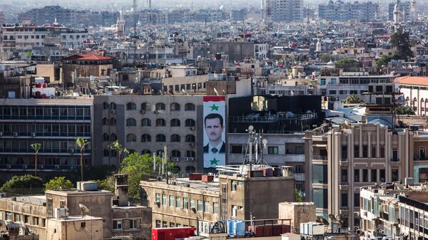 Портрет президента Сирии Башара Асада на стене дома в центре Дамаска. Архивное фото