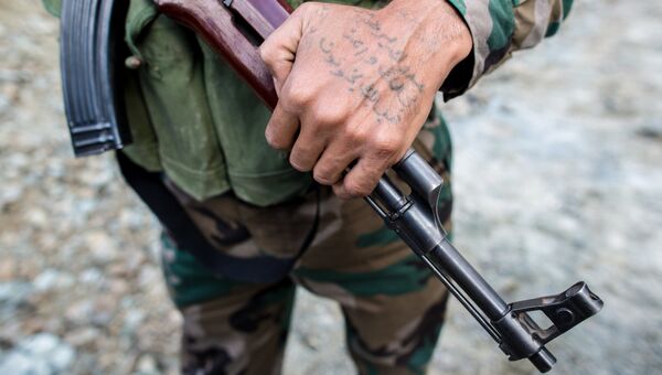 Татуировка на руке солдата сирийской армии