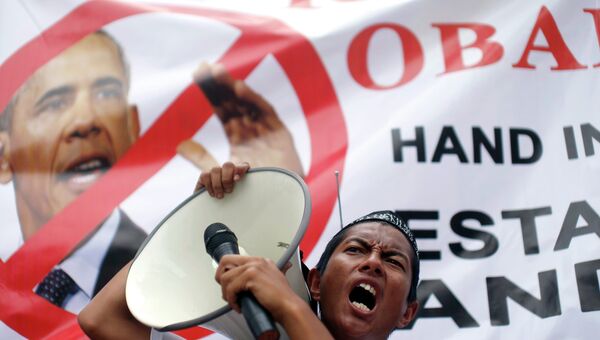Демонстрации протеста против предстоящего визита в Малайзию Барака Обамы