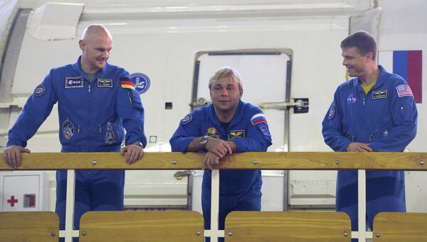 Александр Герст (ЕКА, Германия), Максим Сураев (Роскосмос, Россия), Рид Вайзман (НАСА, США)