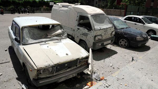 Последствия ракетного обстрела в Дамаске. 29 апреля 2014