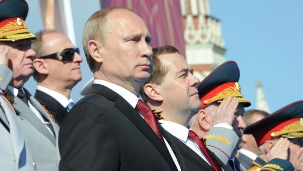 Президент РФ Владимир Путин во время военного парада на Красной площади 9 мая 2014