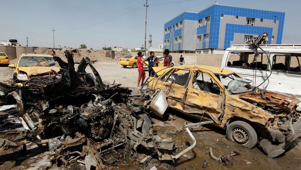 На места взрыва в Багдаде. 13 мая 2014