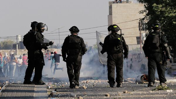 Израильская полиция во время беспорядков в арабской части Иерусалима, 4 июля 2014