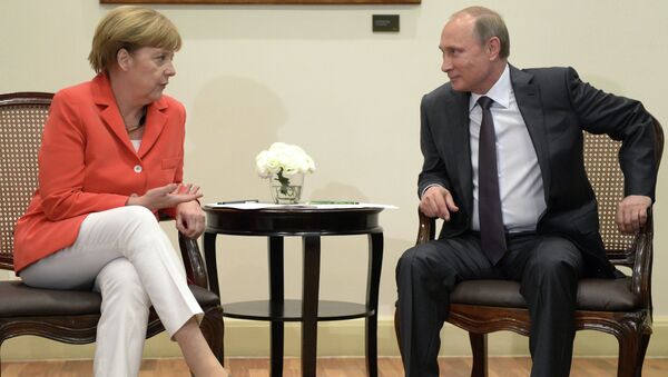 Президент России Владимир Путин и канцлер Германии Ангела Меркель во время встречи в Рио-де-Жанейро