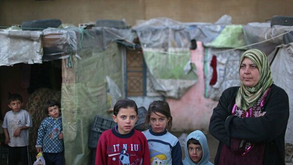 Сирийские беженцы в долине Бекаа в Ливане. Архивное фото