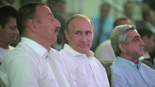 Ильхам Алиев, Владимир Путин и Серж Саргсян в Сочи на турнире по самбо. 9 августа 2014 г
