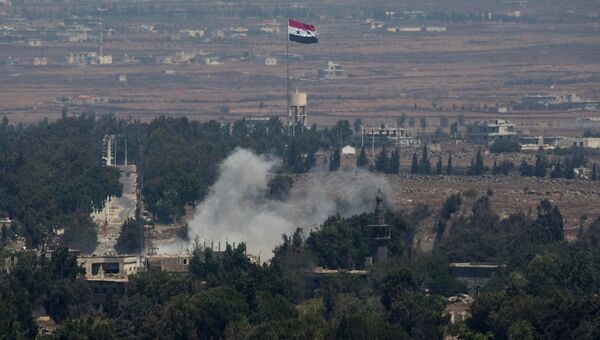 Дым после взрыва между Голанскими высотами и Сирией