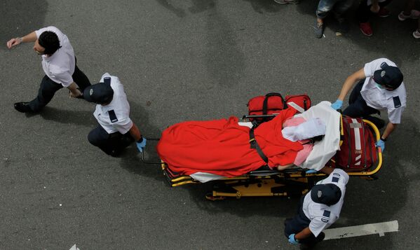 Раненый участник акции протеста в Гонконге