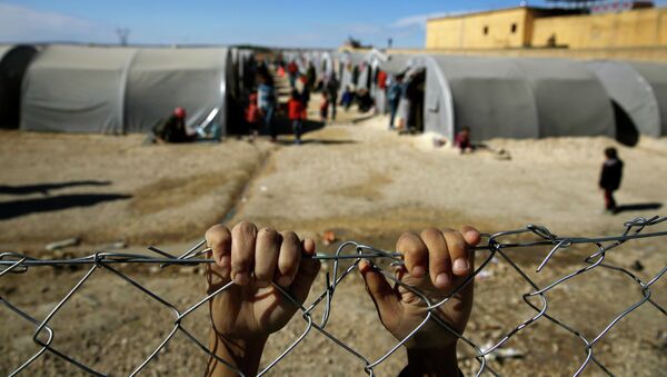 Сирийский мальчик в лагере для беженцев