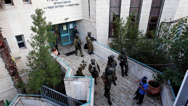 Полиция возле синагоги в районе Хар-Ноф на западной окраине Иерусалима, на которую было совершено нападение