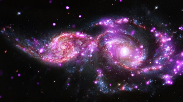 Изображение слияния двух спиральных галактик - GC 2207 и IC 2163