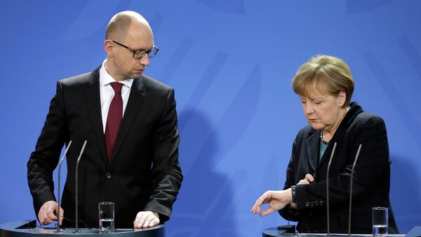 Арсений Яценюк и Ангела Меркель во время встречи в Берлин. 8 января 2015