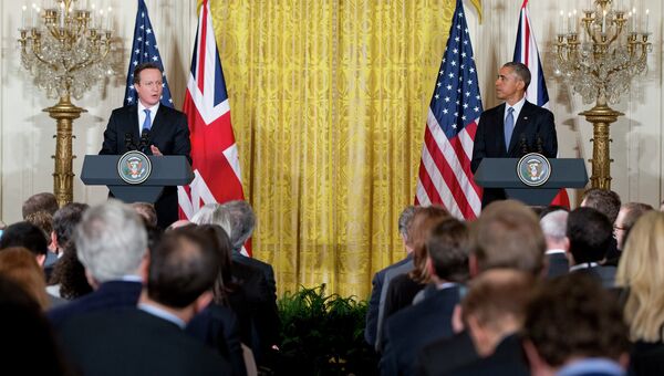 Премьер-министр Великобритании Дэвид Кэмерон и президент США Барак Обама на пресс-конференции в Белом доме. Вашингтон