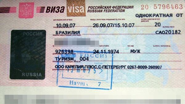 Виза РФ в паспорте иностранного туриста. Архивное фото