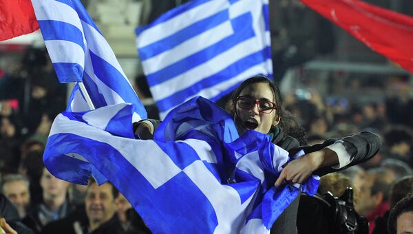 Женщина во время выступления лидера партии СИРИЗА Алексиса Ципраса. Афины, 25 января 2015 года