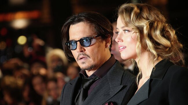 Американская актриса Эмбер Хёрд и американский актёр Джонни Депп. 19 января 2015