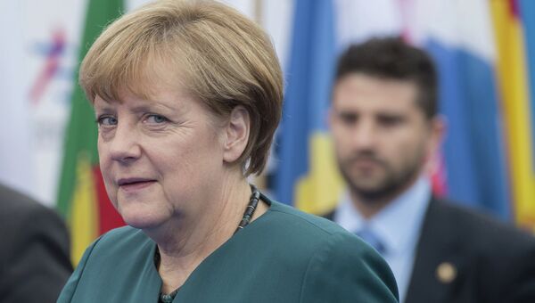 Федеральный канцлер Германии Ангела Меркель перед началом заседания саммита форума Азия-Европа