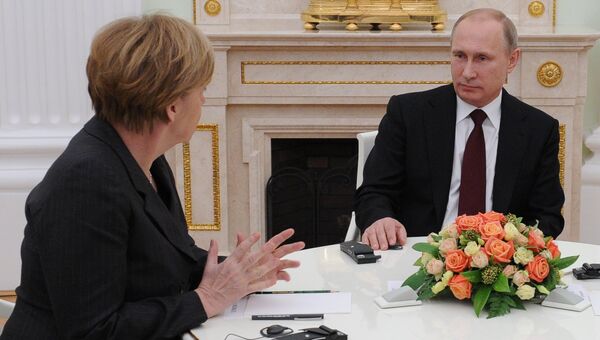 Президент России Владимир Путин и федеральный канцлер Германии Ангела Меркель. Архивное фото