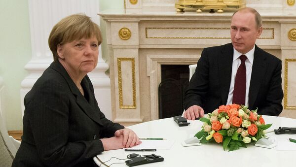 Президент России В.Путин с канцлером ФРГ А.Меркель, во время встречи глав государств России, Франции и Германии