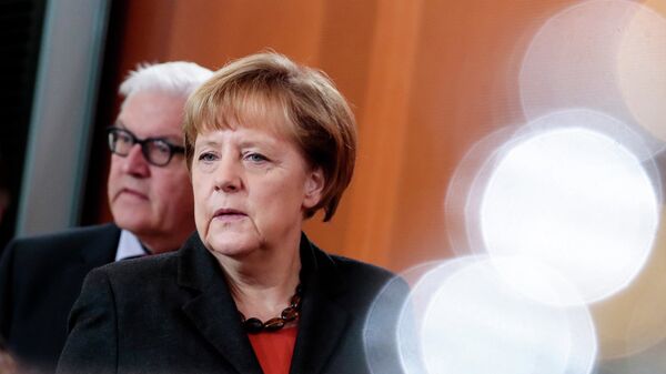Франк-Вальтер Штайнмайер  и Ангела Меркель. Архивное фото