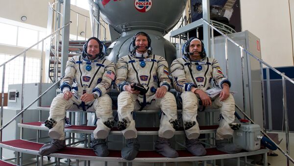 Астронавт НАСА Скот Келли и космонавты Роскосмоса Геннадий Падалка и Михаил Корниенко. Архивное фото