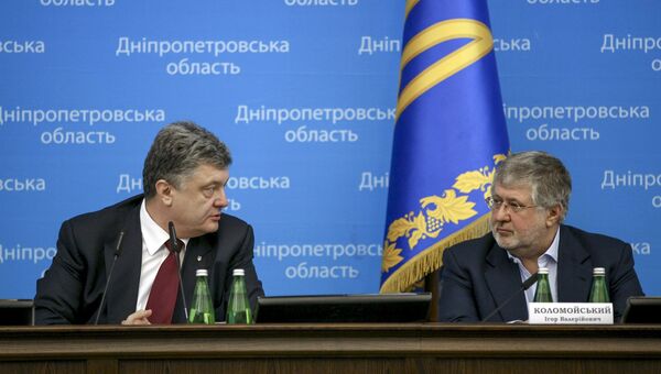 Президент Украины Петр Порошенко и экс-губернатор Днепропетровской области Игорь Коломойский
