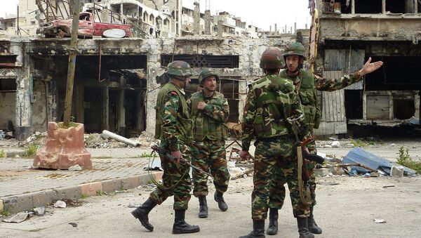 Солдаты правительственных войск на улицах города Хомс, Сирия. Архивное фото