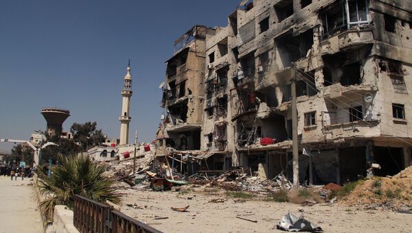 Разрушенный дом в лагере палестинских беженцев Ярмук на окраине Дамаска. Архивное фото
