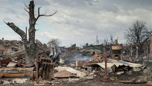 Последствия пожара в деревне Новоенисейка Республики Хакасия