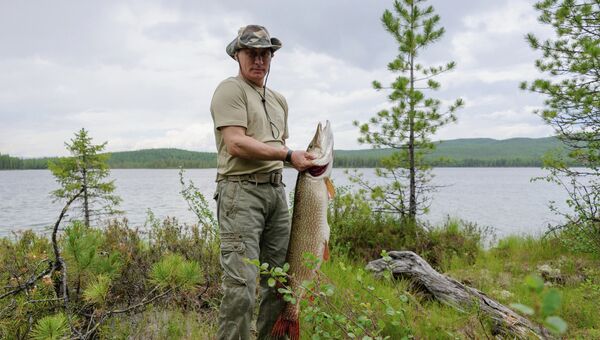Президент России Владимир Путин во время рыбалки в Красноярском крае. Архивное фото
