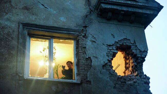 Дом пострадавший в результате обстрела Донецка