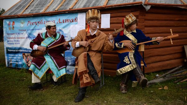 Artists during a performance in the village of Ulagan, Altai Republic