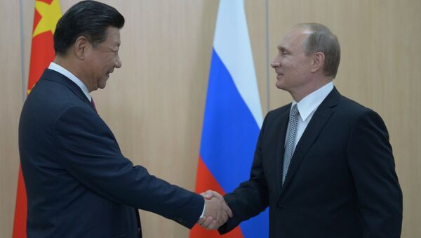 Президент Российской Федерации Владимир Путин и Председатель Китайской Народной Республики Си Цзиньпин. Архивное фото
