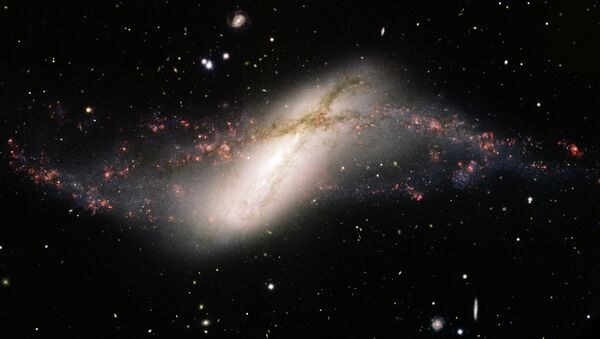 Галактика NGC 660 в созвездии Рыб, где проснулась черная дыра