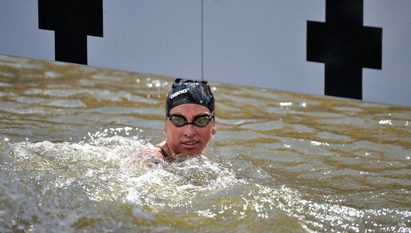 Хейли Андерсон (США) финиширует на дистанции 5 км на открытой воде среди женщин на XVI чемпионате мира по водным видам спорта в Казани