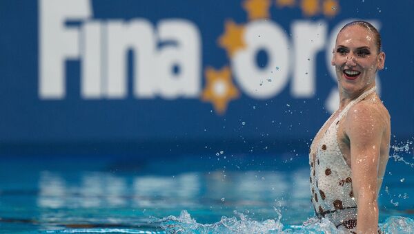 Светлана Ромашина (Россия) выступает с технической программой в предварительном раунде соревнований по синхронному плаванию на XVI чемпионате мира по водным видам спорта в Казани