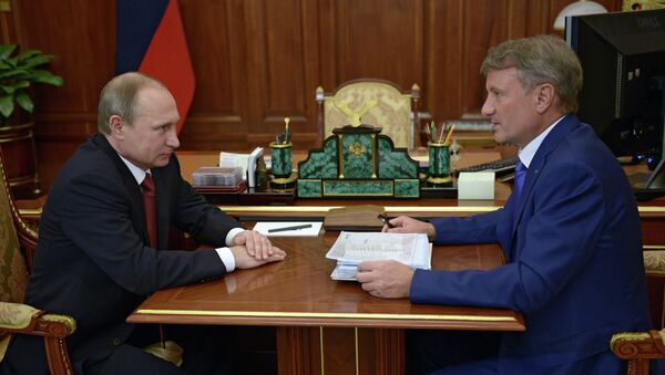 Президент России Владимир Путин и председатель правления Сбербанка РФ Герман Греф. Архивное фото