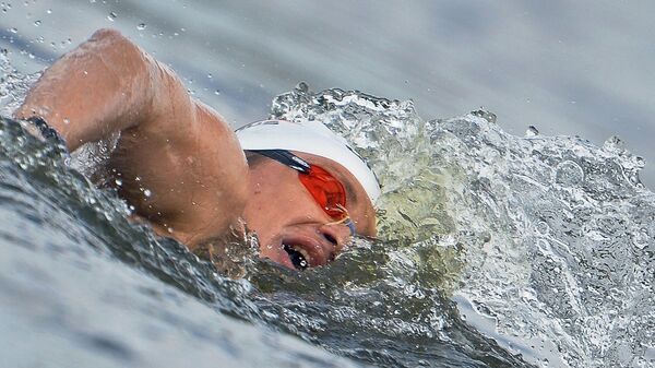 Российский спортсмен Евгений Дратцев на дистанции 25 км на открытой воде. Архивное фото