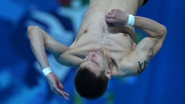 Виктор Минибаев (Россия) в соревнованиях по прыжкам в воду с вышки 10 м среди мужчин на XVI чемпионате мира по водным видам спорта в Казани
