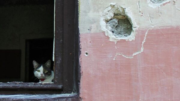 Поврежденный в результате обстрела дом в Горловке. Архивное фото