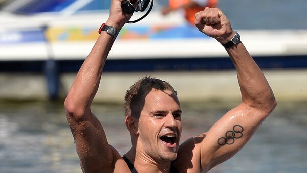 Ричард Вейнбергер (Канада) после финиша на дистанции 10 км на открытой воде среди мужчин