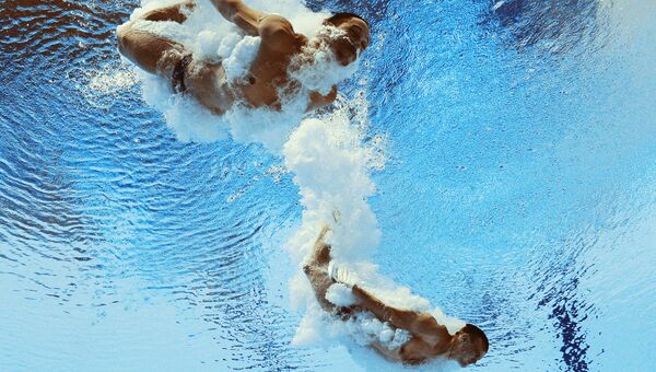 Илья Кваша и Александр Горшковозов (Украина) в соревнованиях предварительного раунда по синхронным прыжкам в воду. Архивное фото