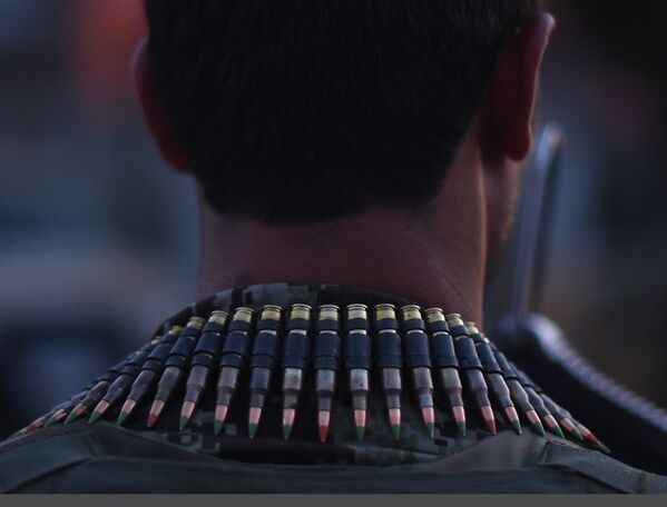 Сотрудник афганских сил безопасности на месте взрыва в Кабуле