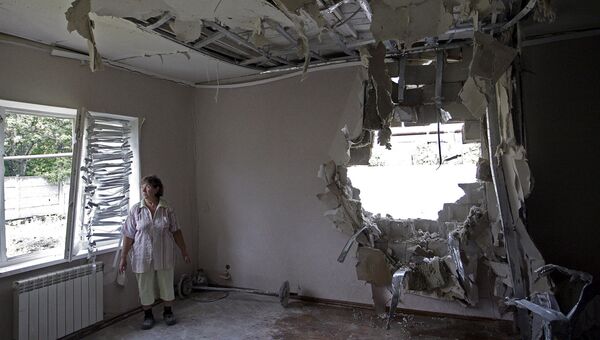 Дом пострадавший во время обстрела Донецка