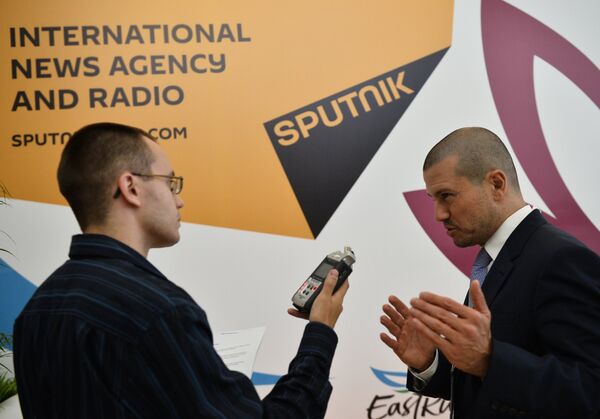Стенд новостного агентства Спутник на Восточном экономическом форуме во Владивостоке