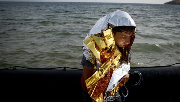 Мигрант из Сирии на побережье Греции. Сентябрь 2015