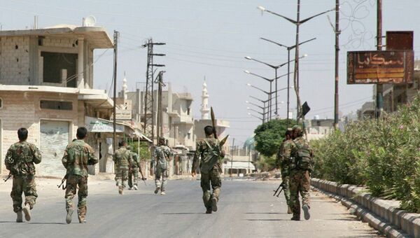 Солдаты сирийской армии в одной из деревень провинции Хама, Сирия. Архивное фото